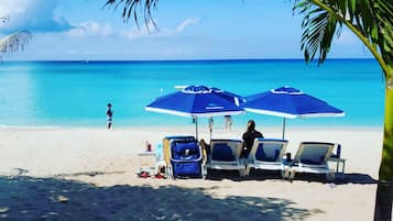 On the beach, sun loungers, beach umbrellas, beach towels