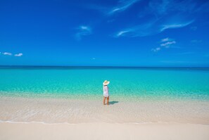 On the beach, sun-loungers, beach umbrellas, beach towels