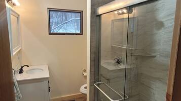 Shower, towels, soap, toilet paper