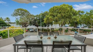 Enjoy al fresco dining with a view of the surrounding water and lush greenery.