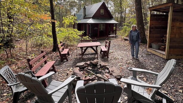 A rustic cabin with a fire pit and Adirondack chairs in a forest setting. - Rickett's Glen state Park!  Our cabin is only 1/2mile from the trail head. (Benton)
