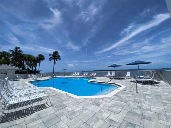Outdoor pool, a heated pool - Sanibel Harbour Resort - Panoramic Beachfront Luxury 2/2 Condo! (Fort Myers)