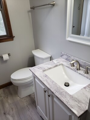 Combined shower/bathtub, soap, toilet paper