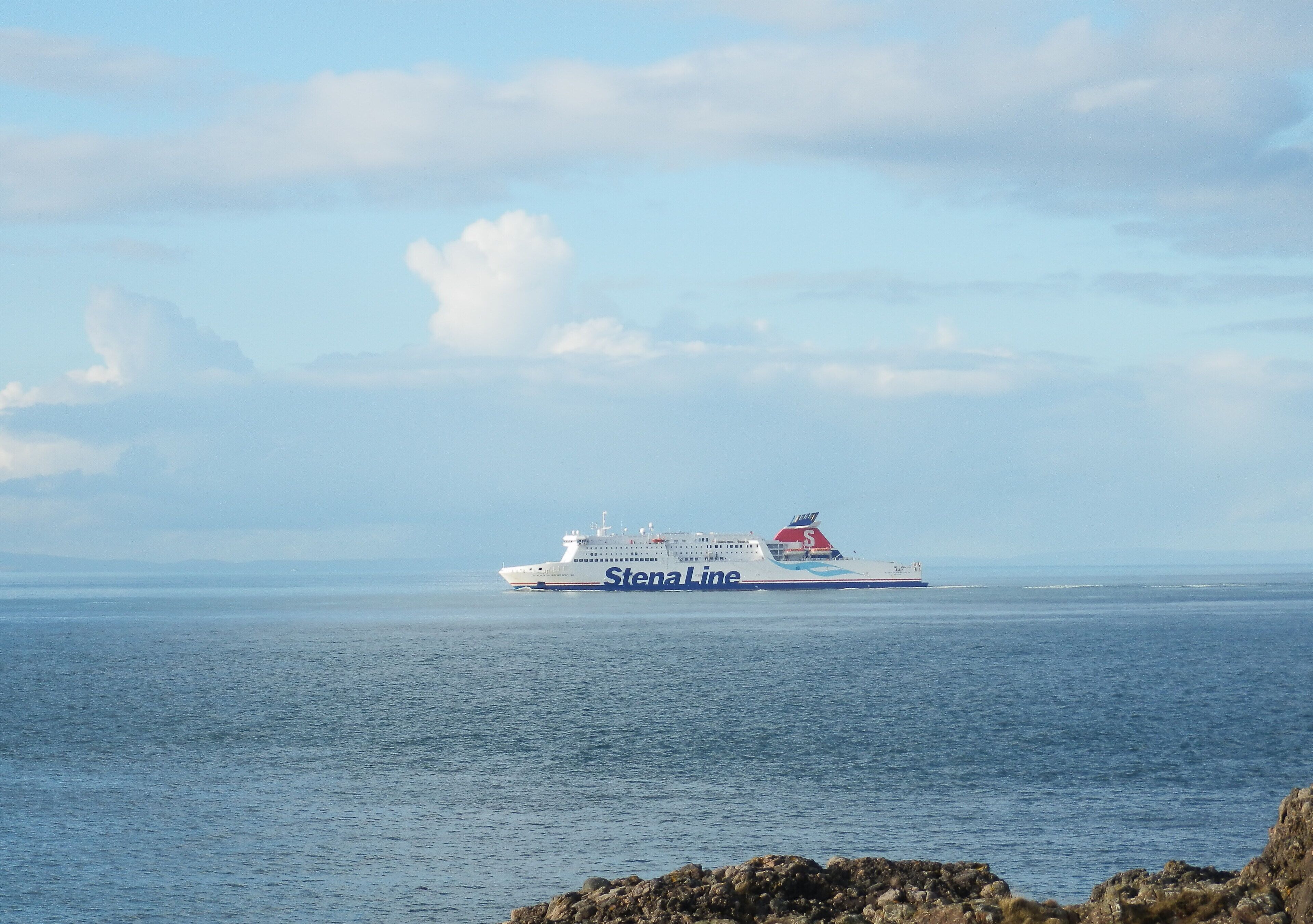 A large cruise ship named Stena Line sailing on the ocean.