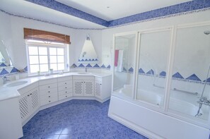 Bathtub, hair dryer, towels