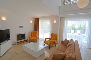 TV, fireplace - luxury 3 bedroom city villas in oludeniz for rent with private pool and garden (fethiye)