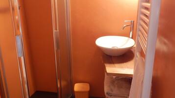 Shower, hair dryer, towels, toilet paper