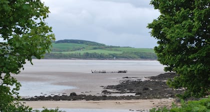 Cottage with stunning views over Kirkcudbright Bay, a short walk from the beach.