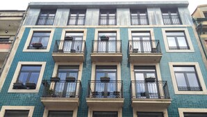 A multi-story building with balconies, windows, and a tiled facade. - I Love Alegria - cosy Studio (Porto)
