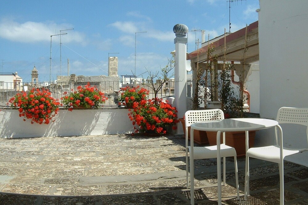 Polignano a Mare, Red Flowers house with terrace