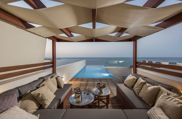 A heated pool, sun loungers