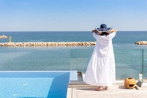 A heated pool, sun loungers