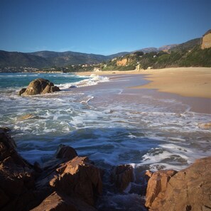 A beach with waves, rocky foreground, and distant hills. - House / Villa - SAGONE (Coggia)