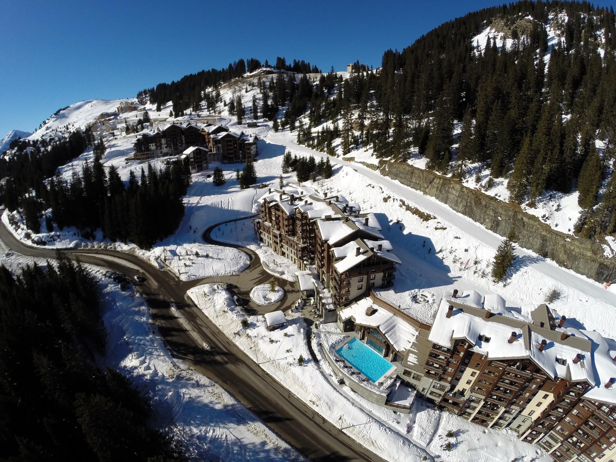 Aerial picture of the building showing the pool.
