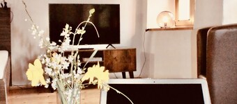 under a historical exposed wooden beam ceiling, monument protection