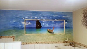 A bathroom with a mural of a boat on water, a sink, and a mirror. - Detached house, fireplace, huge garden, small stream, idyllic, tranquillity, pure nature (Mittenwalde)