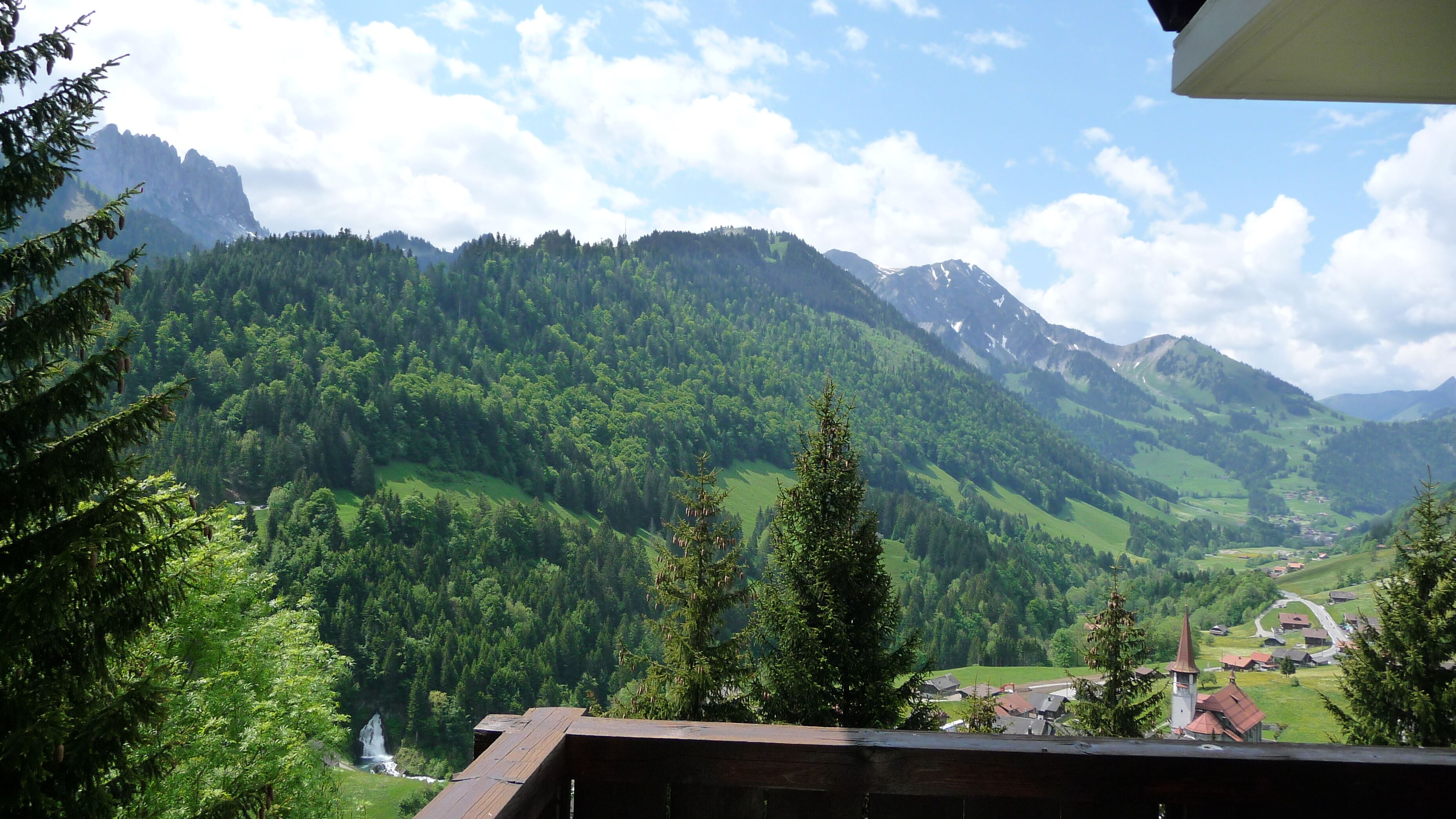 Panoramic view from the balcony: Valley + village + waterfall