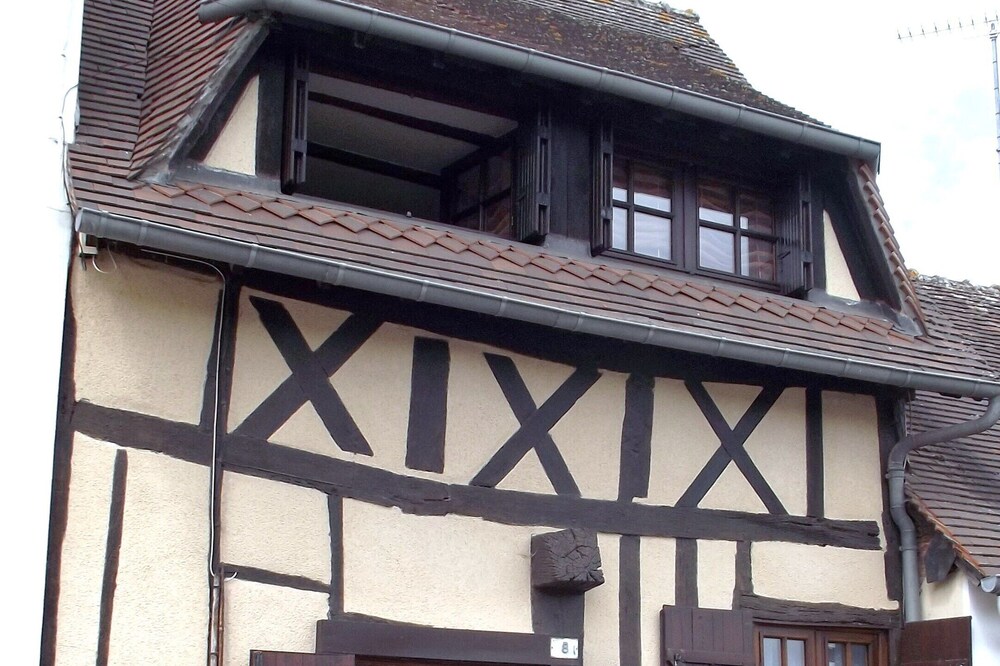 Small Half-timbered norman house in village with all convenience store