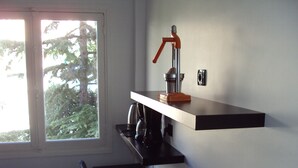 A kitchen with a window, a coffee maker, and a toaster on the counter. -  Beautiful Cannes Apartment (Cannes)