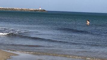 On the beach, sun loungers