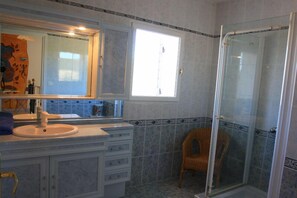Combined shower/tub, hair dryer, towels, toilet paper