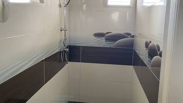 Shower, hair dryer, towels, soap