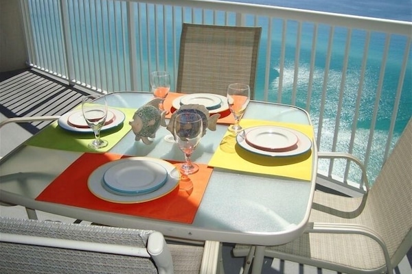 Have your breakfast at this table with festive dinnerware overlooking gulf