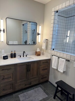 Combined shower/tub, hair dryer, towels, soap