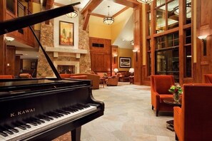 Experience live music in our grand lobby, featuring a grand piano and comfortable seating areas.