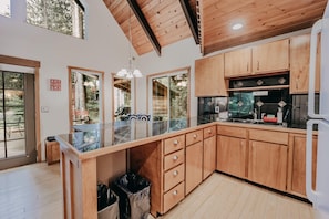 Enjoy cooking in this well-lit kitchen with a large island and ample workspace.