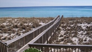 A wooden boardwalk leading to a beach with clear blue water. - Seagull-Gulf Front Home with Private Beach Crossover No Pets (Navarre)