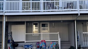 A multi-story residential building with a balcony on the upper floor. - Oceanblock,  steps to best beach in Bethany (Bethany Beach)