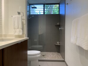 Bathtub, hair dryer, towels