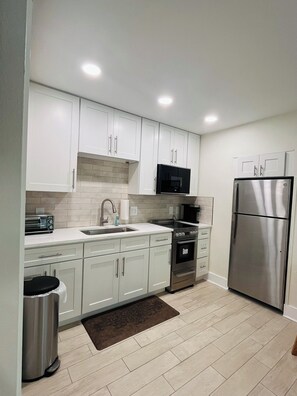 Fridge, microwave, oven, stovetop - Newly Renovated Madeira Beach Studio Cottage (Madeira Beach)