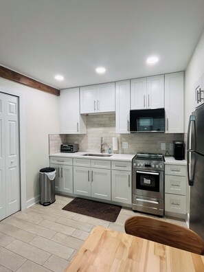 Fridge, microwave, oven, stovetop - Newly Renovated Madeira Beach Studio Cottage (Madeira Beach)