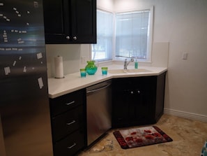 Kitchen is spacious and modern.