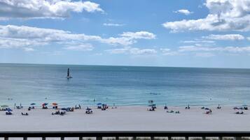 On the beach, sun loungers, beach towels