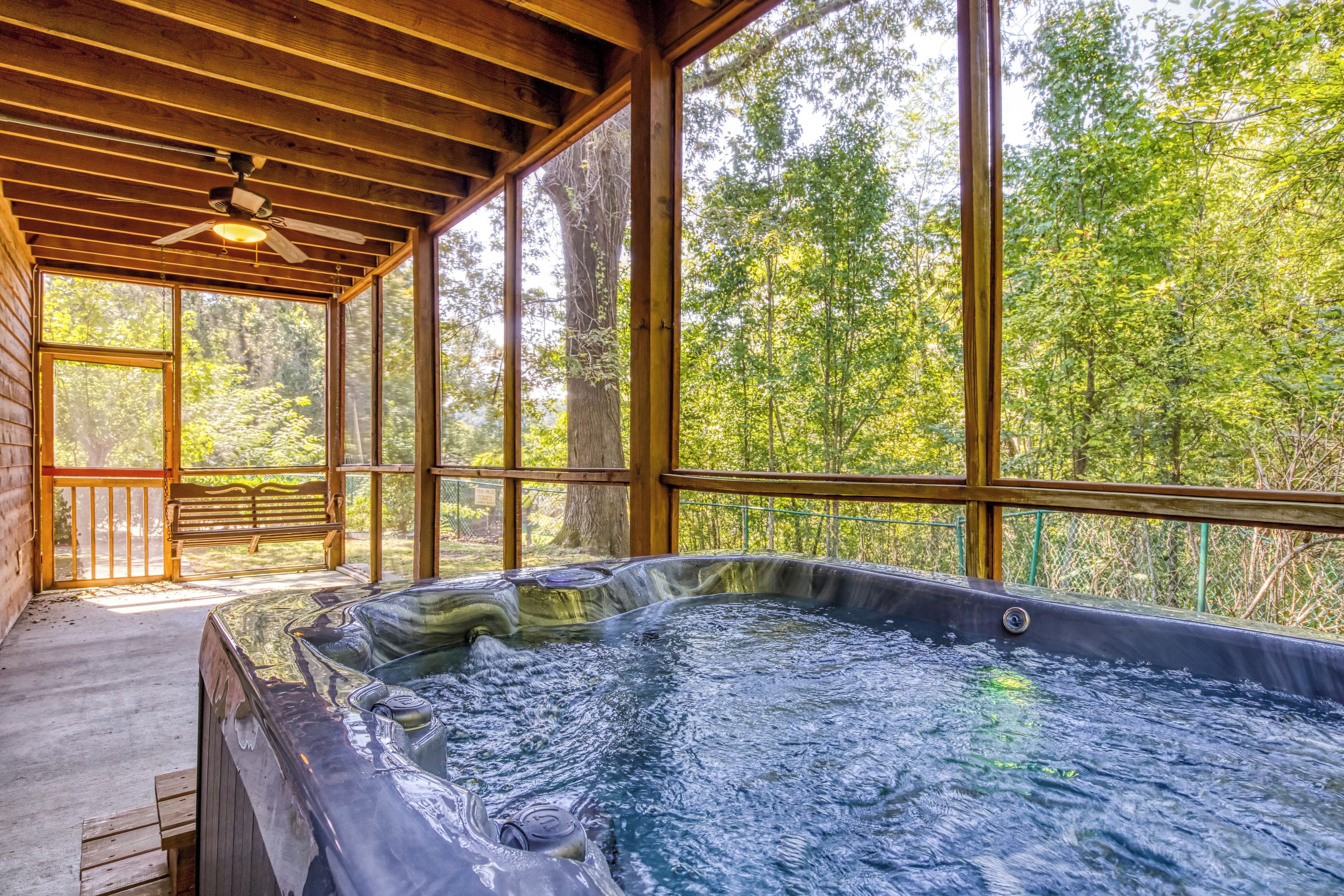 Smoky Mountain Cabin with a Pool Table "Whispering River" - Lower level patio with hot tub