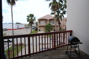 Enjoy al fresco dining on the balcony with a barbecue grill overlooking the street.