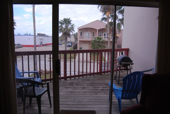 Enjoy a meal on the balcony with a barbecue grill and comfortable seating for three.