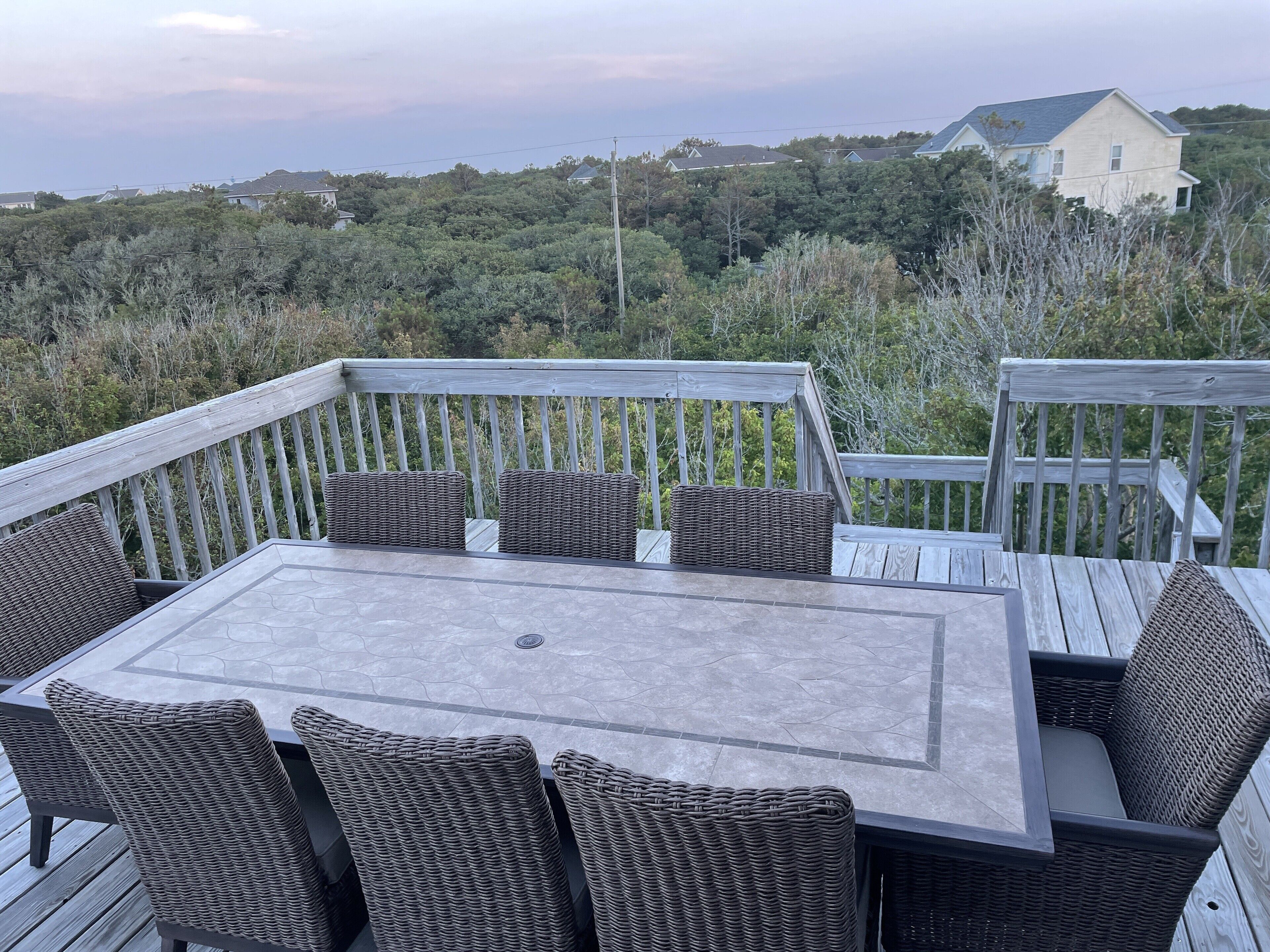 Comfortable, private outdoor dining for eight. Ocean view. 