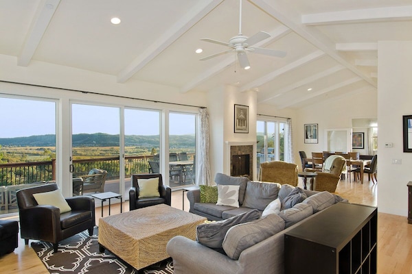 Great Room with living area, fireplace, dining area and more views!