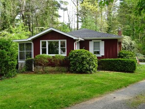 Set amidst a serene and lawn, this charming house offers a peaceful retreat.