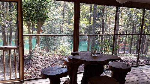 Waterfront cabin, treehouse embraced by 52 acre nature preserve and USFS