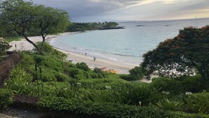 A coastal landscape with a beach, greenery, and a view of the sea. - Uninterrupted Sunset, Ocean and Golf Course Views from our Lanai and Interior (Kamuela)