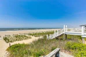 A wooden boardwalk leading to a beach with a clear view of the ocean. - "Just Breathe" - 2nd Row Home, 3 Bedrooms / 2.5 Bathrooms (Holden Beach)