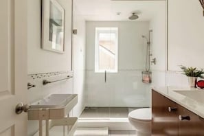 Combined shower/tub, hair dryer, towels, soap