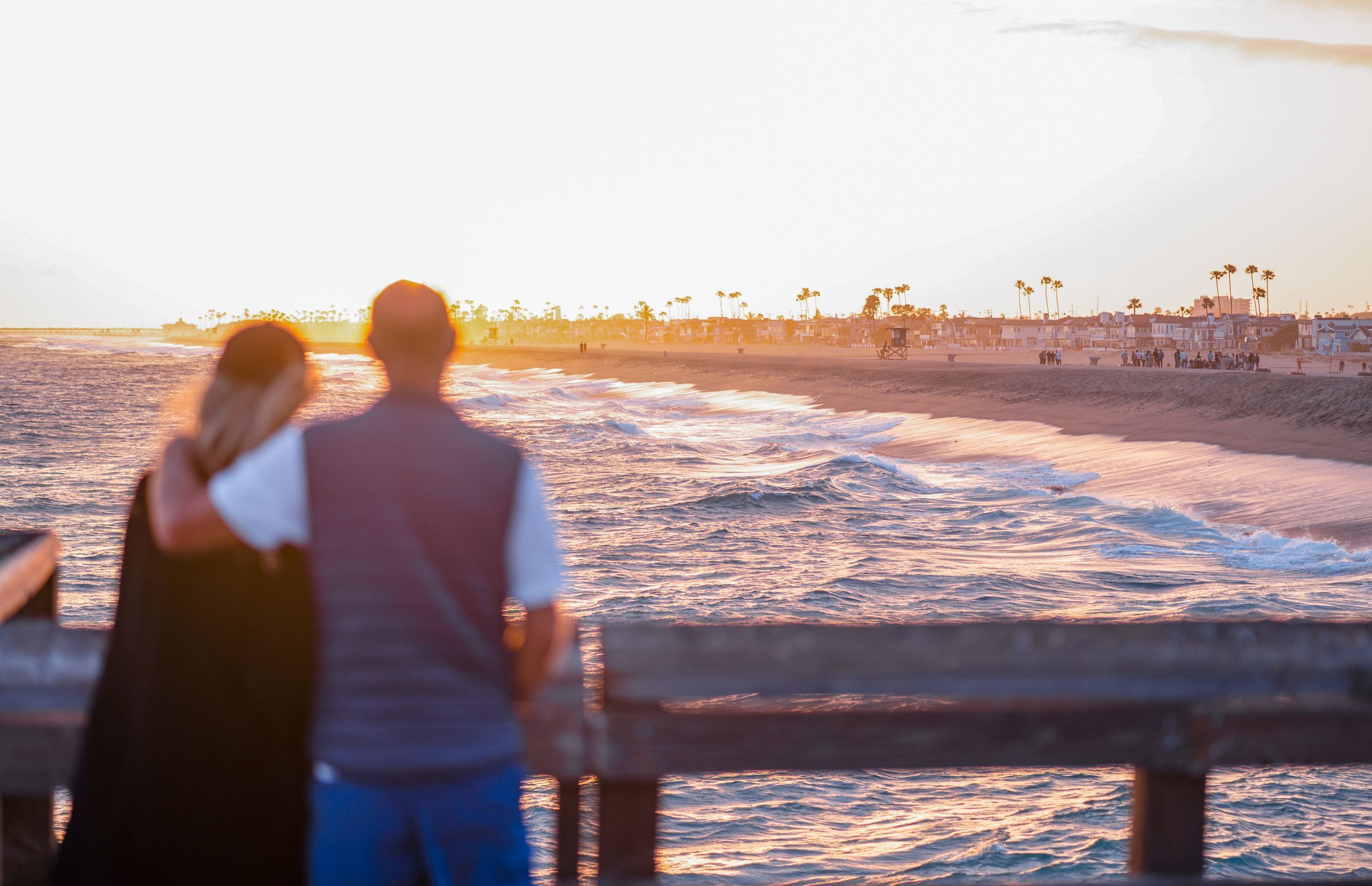 Catch a breathtaking Newport sunset from the pier — the perfect way to end the day.
                