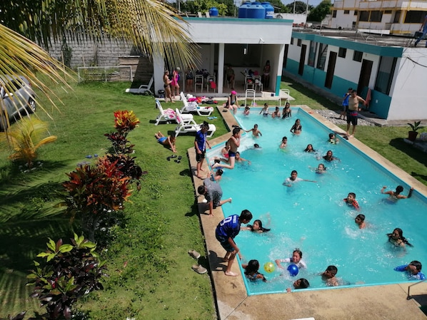 Outdoor pool, open 8:00 AM to 10:00 PM, pool loungers