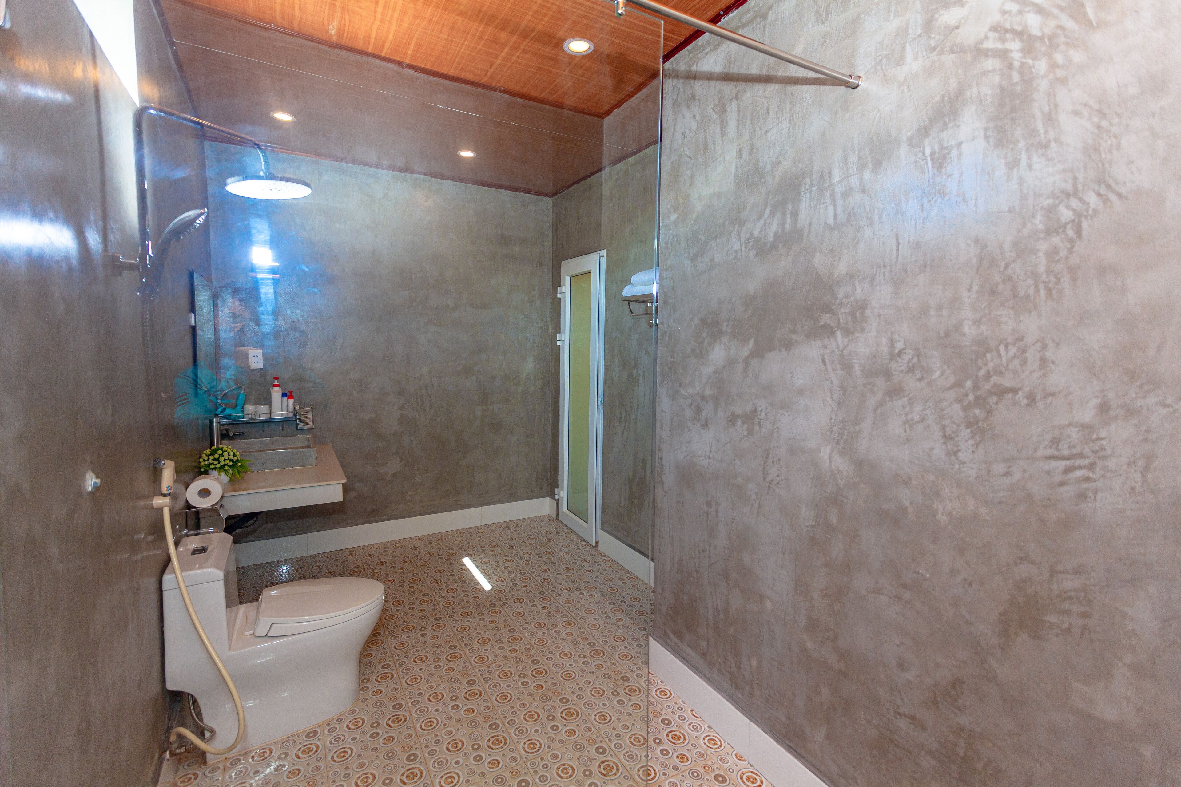 Shower, hair dryer, slippers, towels